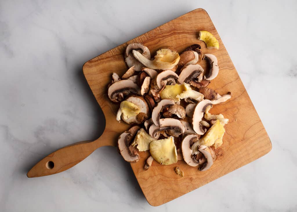 Melange of mushrooms on a cutting board