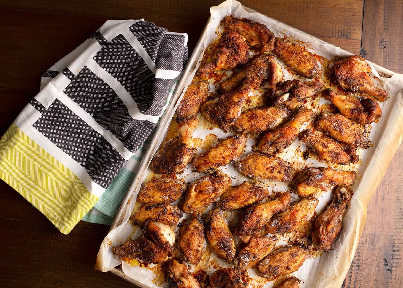 Baking sheet full of baked Crispy Pepper Chicken Wings