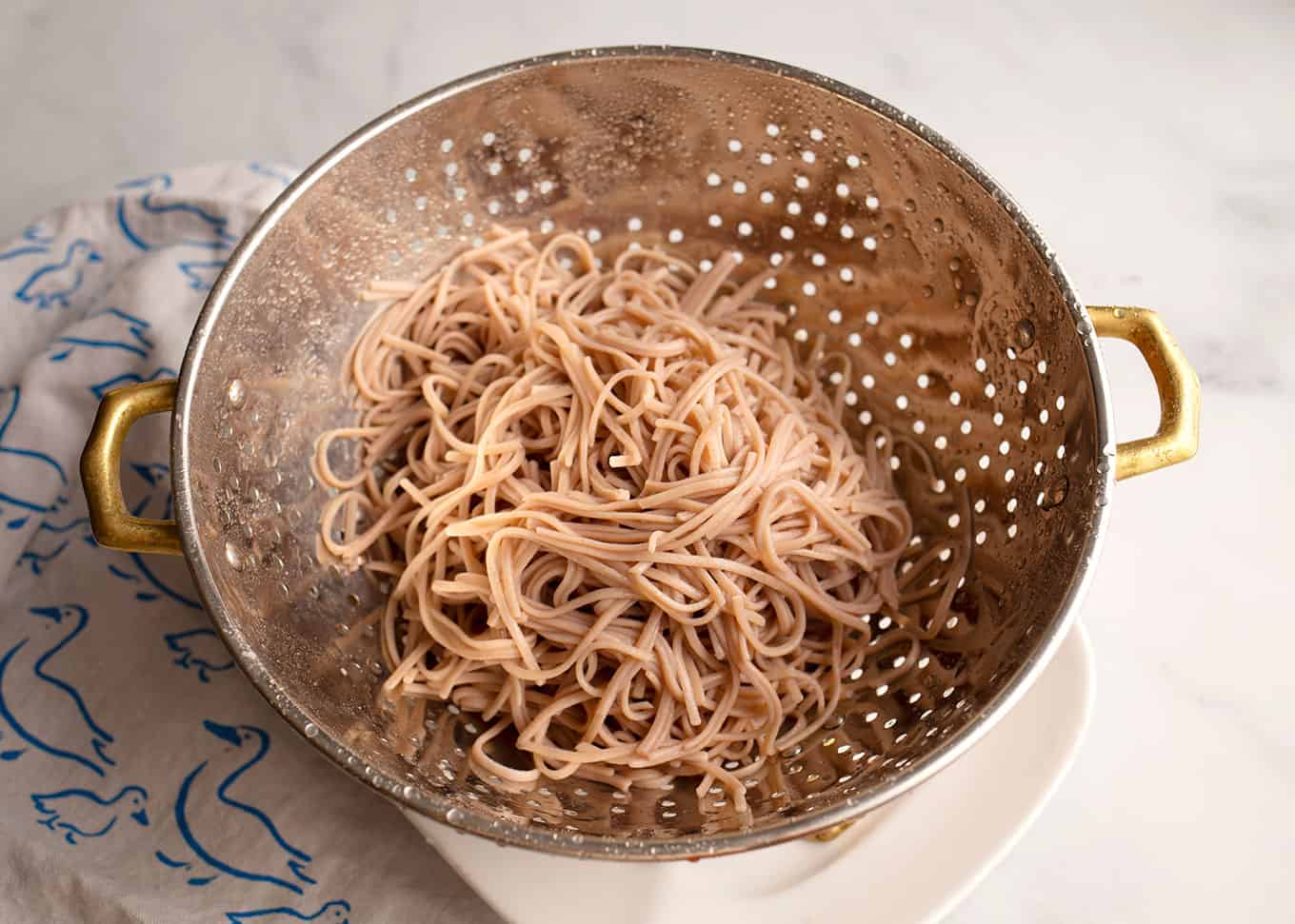 Soba noodles in a colander