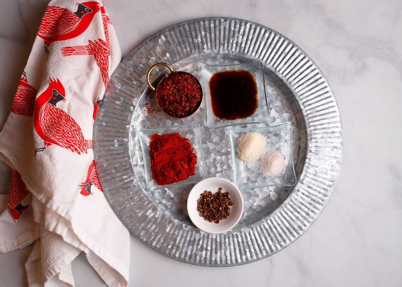 peppercorns, red chili flakes, Gochugaru, soy sauce, sugar and salt, measured in small dishes
