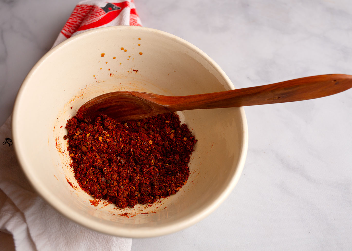 Peppers and seasonings mixed together in a small bowl.