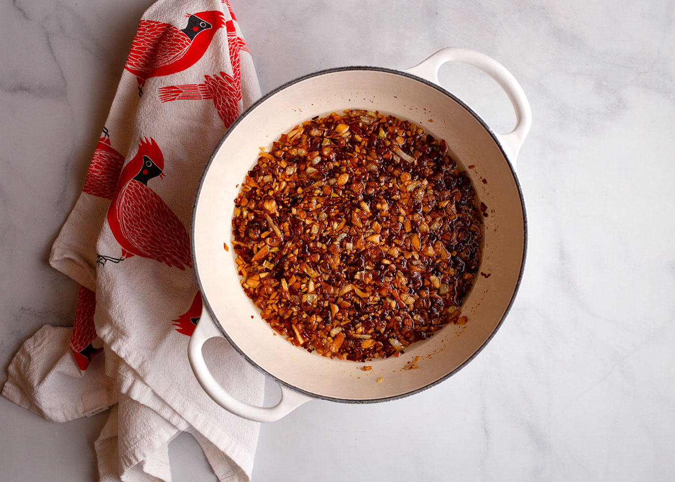 Shallot, garlic, and peppers are golden and crispy in the oil