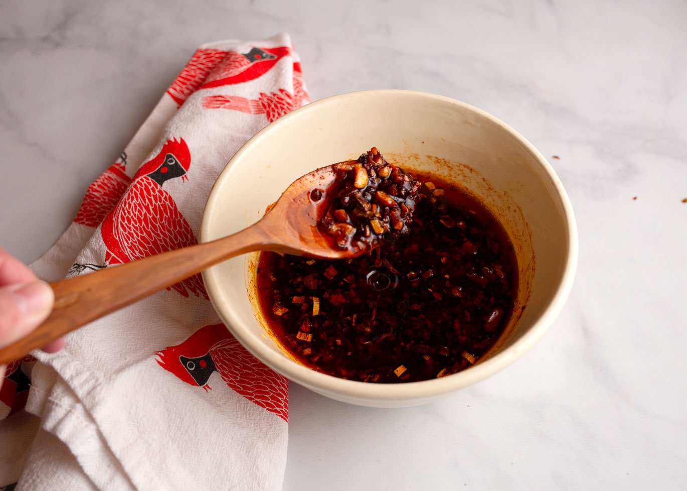 Hot oil poured over the peppers and seasonings.