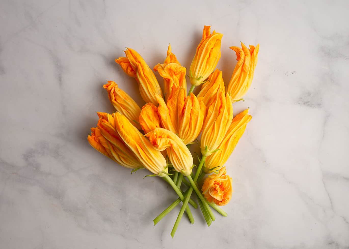 Zucchini flower bouquet laying on the countertop